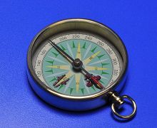 Pocket compass with needle marked red and arrow shaped